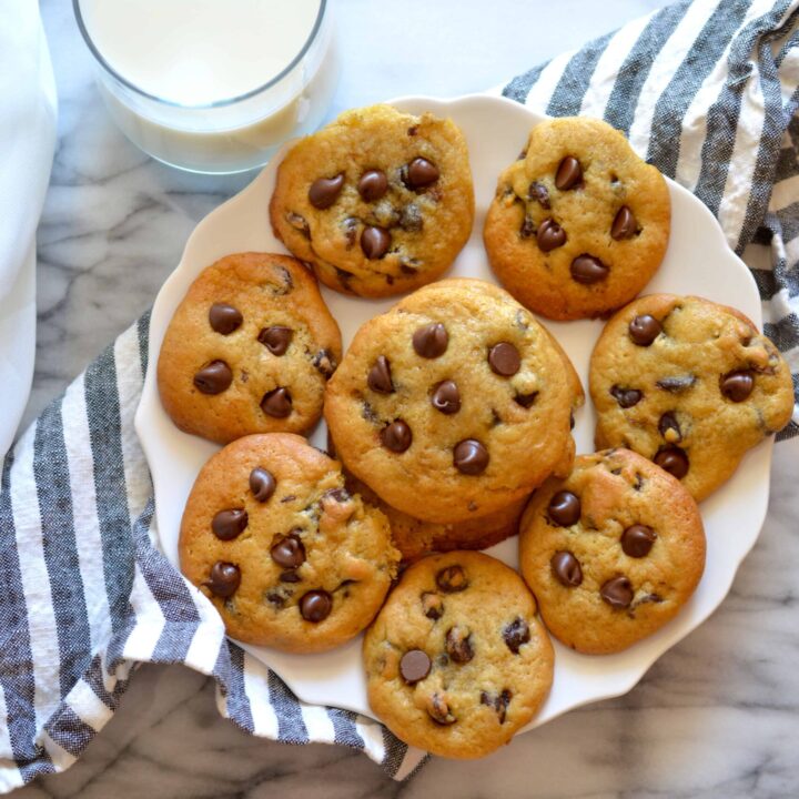Lighten up the classic chocolate chip cookie by using less butter. Super soft and filled with chocolate chips, these Healthier Greek Yogurt Chocolate Chip Cookies are a crowd favorite!