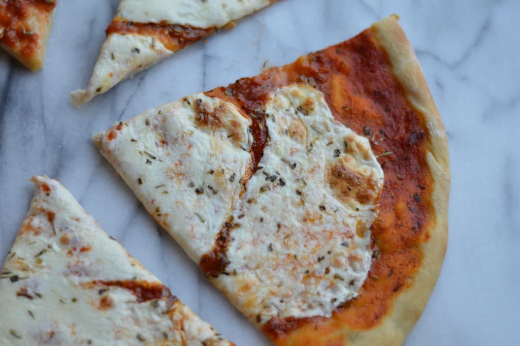 Don't be intimidated by making your own pizza dough, it's quite simple once you get the hang of it! This dough is perfect for a DIY pizza night at home. Everyone gets to pick their favorite toppings!