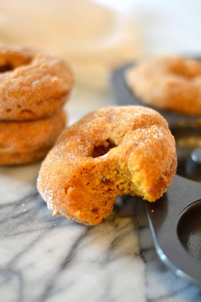 Healthier Baked Pumpkin Donuts are a delicious way to enjoy donuts without frying. This recipe uses no butter or oil, so it’s perfect as a breakfast treat!