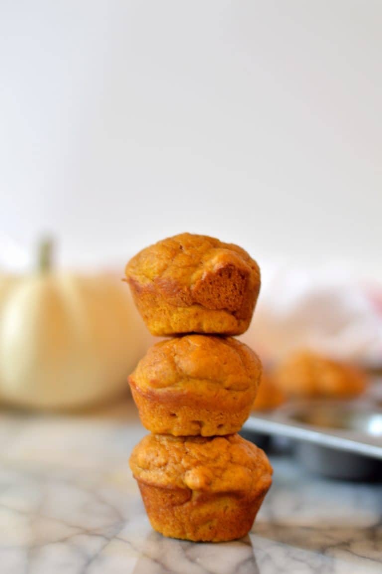 Mini pumpkin muffins are the perfect poppable fall breakfast and pair perfectly with a cup of coffee. These mini muffins are lightened up and contain no butter or oil.