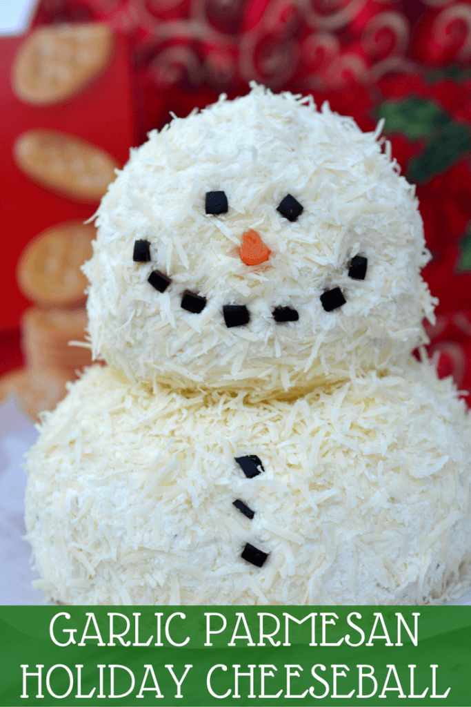 This savory Garlic Parmesan Holiday Snowman Cheeseball contains minimal ingredients and is SO impressive on a holiday platter! Dress up your appetizer spread with something new and festive this holiday season!