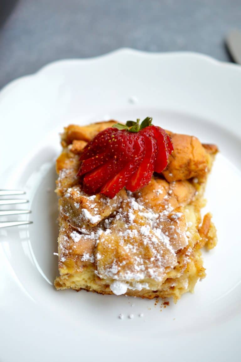 French Toast Casserole is the perfect breakfast or brunch to feed a crowd! Slice this subtly sweet and flavorful breakfast casserole and serve with powdered sugar and maple syrup.