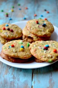 These soft baked cookies are filled with M&Ms candies and are sure to fly off the plate. They are irresistibly fluffy and packed with chocolate!