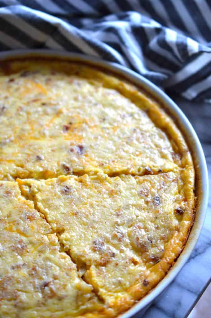 This Cheddar, Bacon & Onion Quiche (also known as Quiche Lorraine) is sure to fly off the table during breakfast or brunch. Perfect for feeding a crowd!