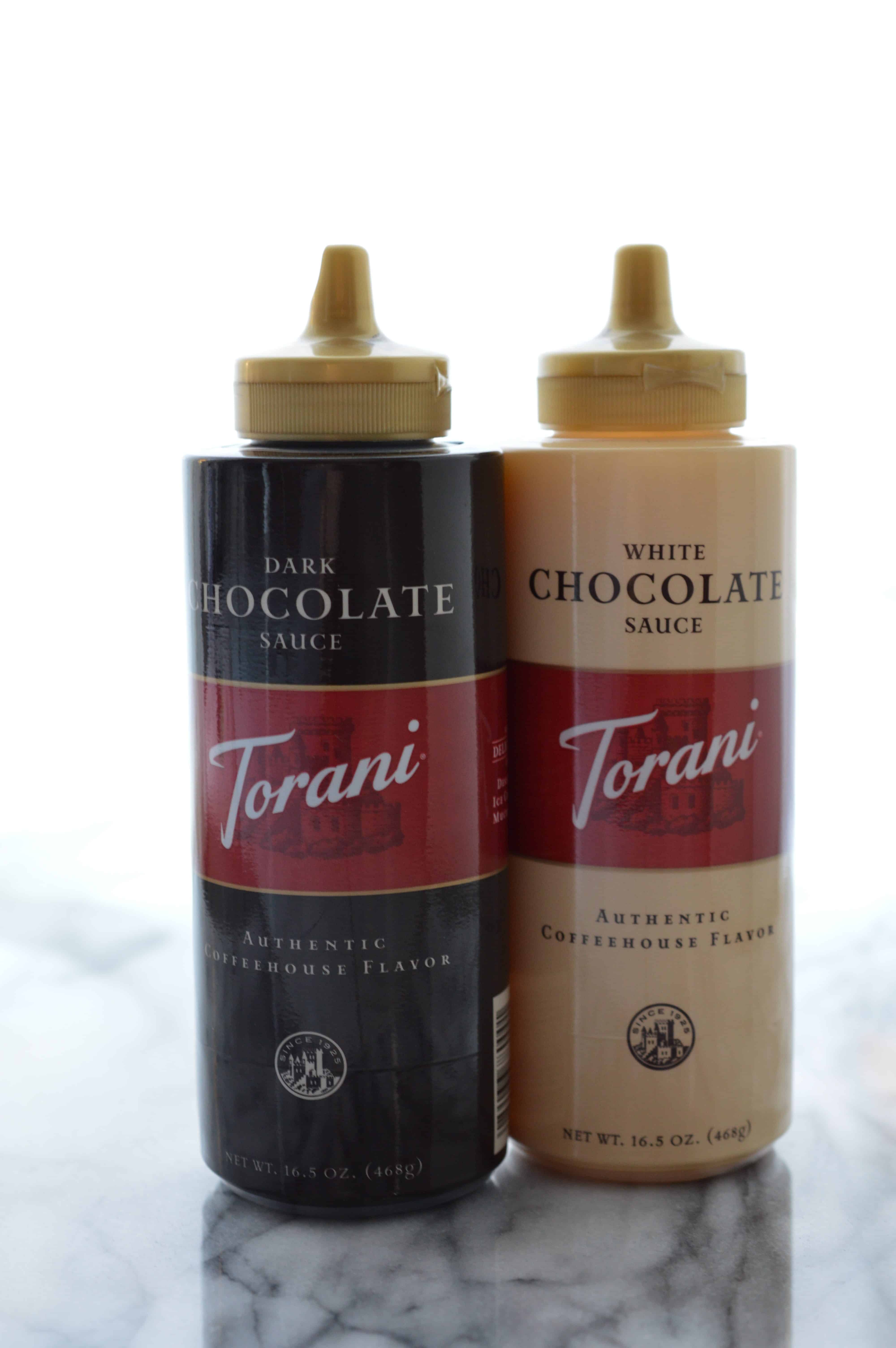 Torani Dark and White Chocolate Sauces in bottles.