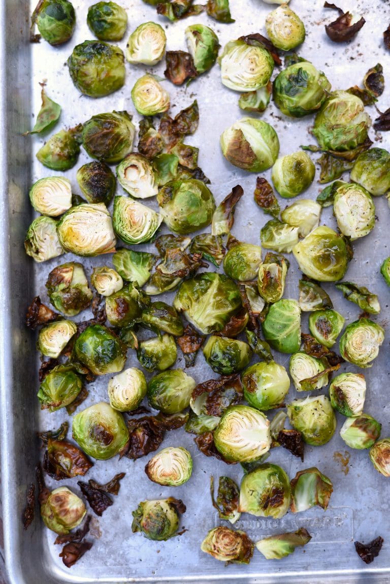 Roasted Brussels sprouts on a baking sheet.