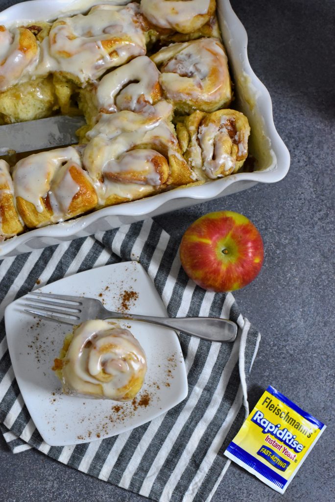 Apple Pie Cinnamon Rolls in a baking dish and on a plate.
