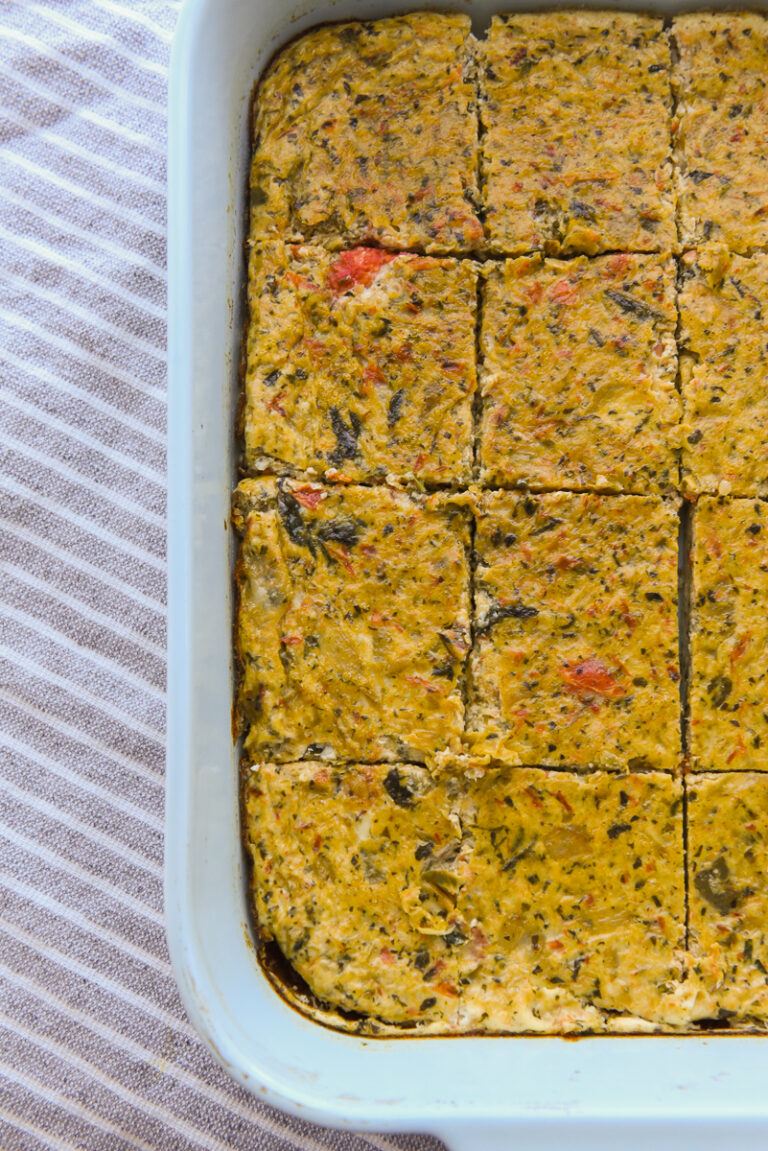 Egg White Frittata Bake sliced in a light blue casserole dish